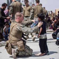 US soldier giving water to Afghani boy Meme Template