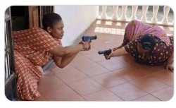 Black ladies pointing guns Meme Template