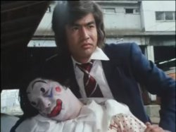 Hiroshi Fujioka holding a dead clown Meme Template