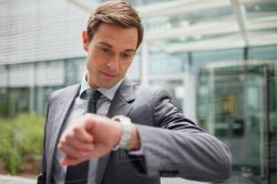 Businessman looking at watch Meme Template