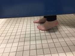 Feet under bathroom stall Meme Template