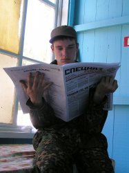 Russian Soldier reading Obituaries. Meme Template