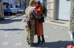 Ukrainian soldier hugs wife Meme Template