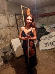 Ukrainian violinist in bomb shelter Meme Template