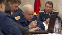 Russian general looking at laptop with magnifying glass Meme Template