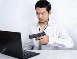 Asian dude pointing a gun at a computer Meme Template