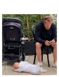 Man on phone baby on ground Meme Template