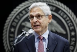 Merrick Garland at microphone Meme Template