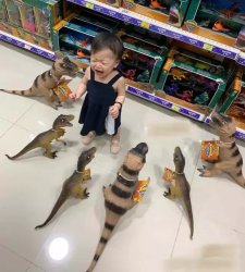 Child surrounded by dinosaurs Meme Template
