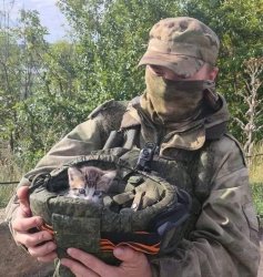 Russian soldier holding cat in a helmet Meme Template