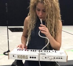 Shakira playing synth Meme Template