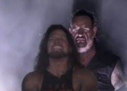 Undertaker behind AJ Styles Meme Template