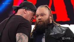 Undertaker whispering to Bray Wyatt at Raw XXX Meme Template