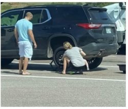 woman changing tire Meme Template
