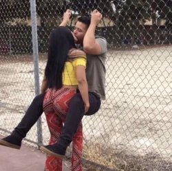 girl kissing guy against fence Meme Template