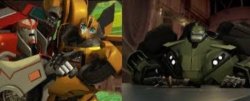 Ratchet (Being Held Back By Bumblebee) Yelling At Bulkhead Meme Template