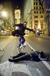 joker skateboarding over bat man Meme Template