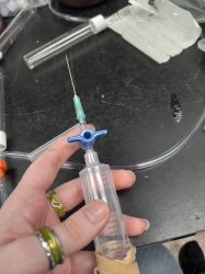hand holding syringe with large needle Meme Template