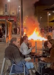 French couple dining behind riots Meme Template