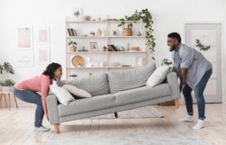 Black Couple Moving Sofa In Living Room Replacing Furniture At H Meme Template