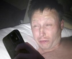 Limmy Waking Up with Phone Meme Template