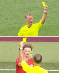 Player counters yellow card from referee with Uno reverse card Meme Template