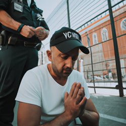 Man praying and police protecting him Meme Template