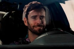 Sad fake smile resigned white male in car Meme Template