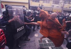 Monk kicking riot police Meme Template