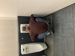 Bending down at urinal Meme Template