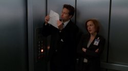 Mulder and Scully Elevator Looking At Paper Meme Template