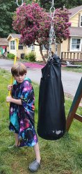 kid holding a crowbar about to hit a Punching Bag Meme Template