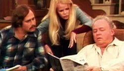 Archie reads newspaper to meathead about Biden 1 Meme Template