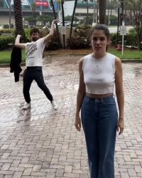 Girl standing and boy being goofy Meme Template