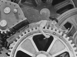 Charlie Chaplin working on Cog Meme Template