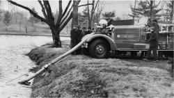 antique fire truck siphoning water Meme Template