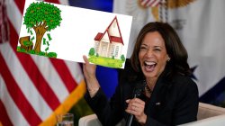 Kamala holds sign with plan for new homeowners Meme Template