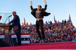 Elon Musk jumping at Donald Trump rally Meme Template