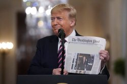 Trump holds up newspaper Meme Template