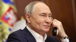 Putin smiling in the phone Meme Template