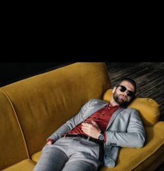 Guy on couch with glasses. Meme Template