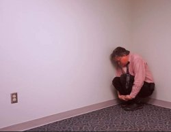 Man huddled in room corner Meme Template