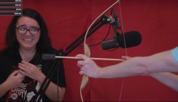 Nathan Drawfee pointing a bow at Karina Drawfee Meme Template