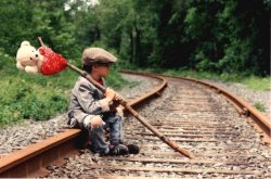 Homeless kid on train track Meme Template