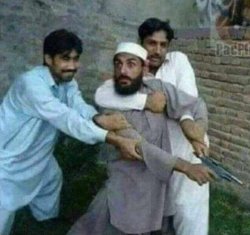 Two men holding back man with gun Meme Template