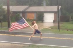 Guy standing in storm with american flag Meme Template