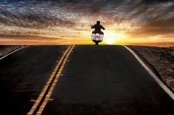 Guy riding motorcycle into the sunset Meme Template