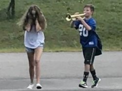 Boy playing trumpet at girl Meme Template