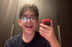 Kid Holding Flip Phone Happy Meme Template