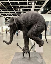 Elephant on man sculpture Meme Template